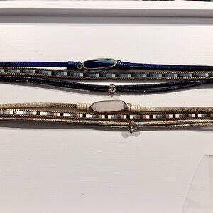 Pair of multi strand leather and jewel bracelets. Navy gold